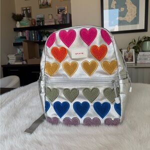 State Silver Backpack with Colorful Heart Accents